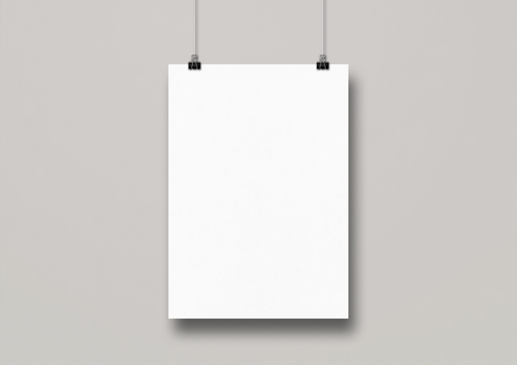 White Poster Hanging on a Clean Wall with Clips